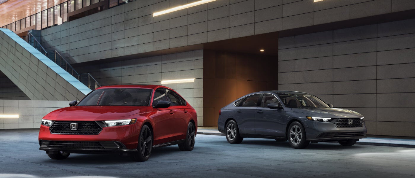 2026 Honda Accord pair by modern building