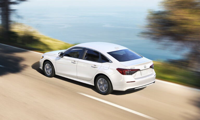 2026 Honda Civic Sedan driving by ocean