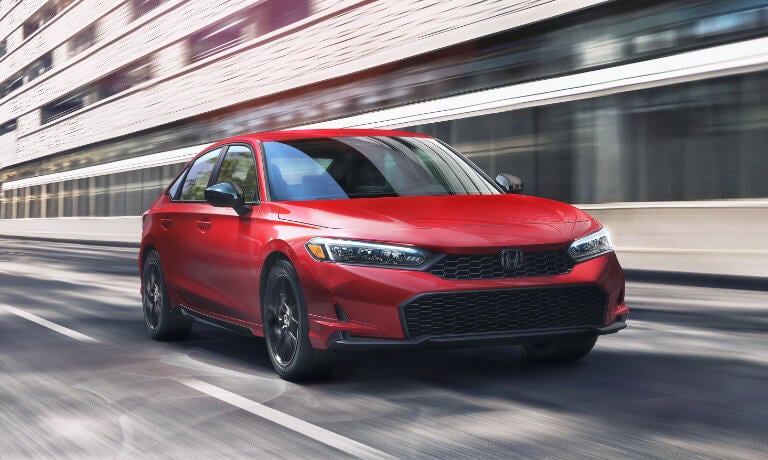 2026 Honda Civic Sedan driving through city