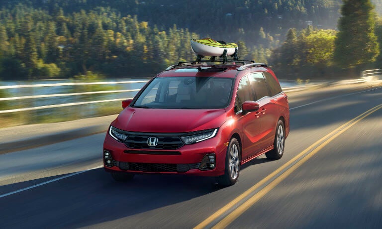 2026 Honda Odyssey driving with kayak on top
