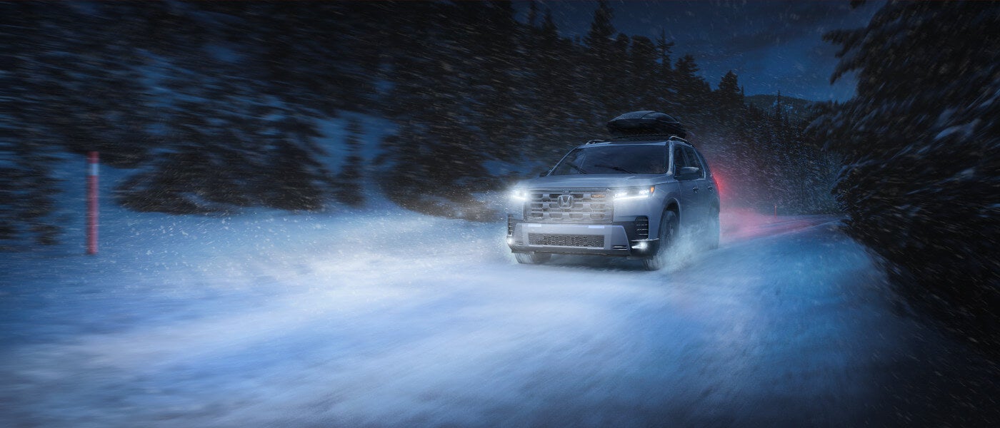 2026 Honda Pilot driving in blizzard at night