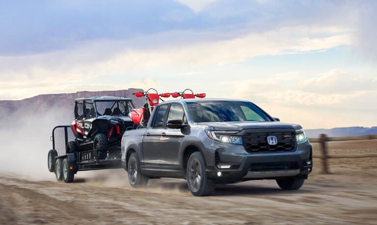 2026 Honda Ridgeline towing an ATV