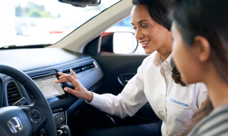 Employee showing customer technology