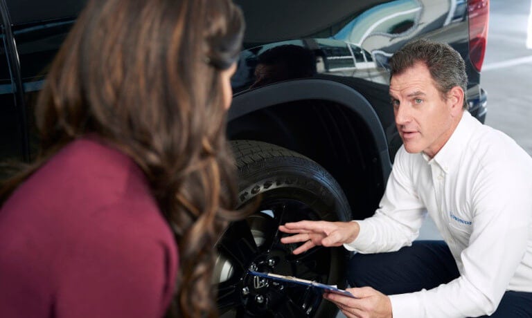 Honda employee checking a tire